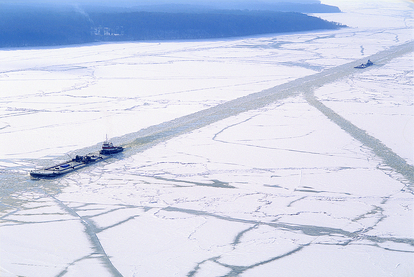 Ice breaker and tanker going through the Potomac River